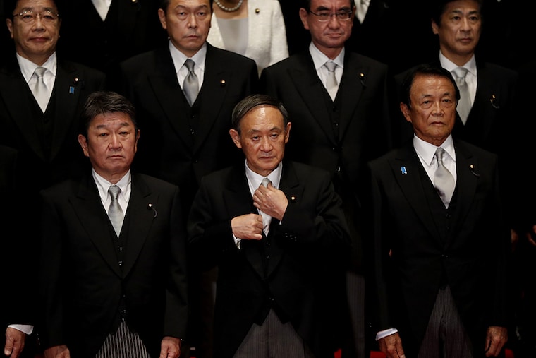 Japan"s Prime Minister, Yoshihide Suga (Front C) leads his cabinet ministers prepare for a photo session at Suga"s official residence in Tokyo, Japan, September 16, 2020.