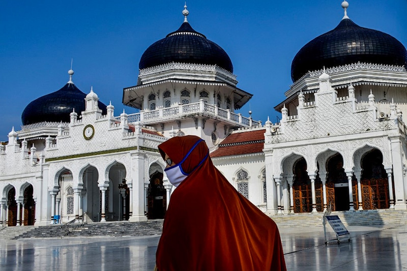 A woman visits the Baiturrahman Grand Mosque ahead of the start of Islam"s holy month of Ramadan in Banda Aceh on April 12, 2021.