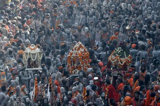 Naga Sadhus participate in a procession to take a dip in the Ganges river during Shahi Snan at "Kumbh Mela", or the Pitcher Festival, amidst the spread of the coronavirus disease, in Haridwar, India, April 14, 2021.
