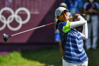 India"s Aditi Ashok watches her drive from the 1st tee in round 3 of the women"s golf individual stroke play during the Tokyo 2020 Olympic Games at the Kasumigaseki Country Club in Kawagoe on August 6, 2021. Ashok has been in the top-two after all three rounds, and a third-round 68 keeps her in position for a silver medal.