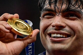 Gold medallist India"s Neeraj Chopra celebrates on the podium during the victory ceremony for the men"s javelin throw event at the Tokyo 2020 Olympic Games in Tokyo on August 7, 2021. Neeraj had a good first throw of over 87 metres, which he later revealed was his plan, to get a good start to put pressure on his rivals.
