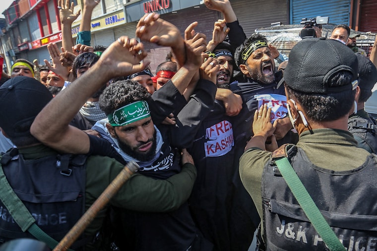 Indian police detain Kashmiri shiite mourners shouting pro-freedom slogans, defying restrictions during a Muharram procession in Srinagar, India on August 17, 2021. The government forces in Kashmir had to resort to tear gas shells and baton charge to disperse crowds in various parts of the region to bar Shiite mourners from carrying out any processions on the eighth day of Muharram.
