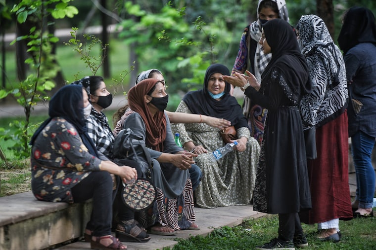 Afghan women gather to protest against the occupation of Afghanistan by Taliban fighters, at Jangpura on August 18, 2021 in New Delhi, India. Jangpura and Lajpat Nagar areas are home to a large number of Afghan refugees who thrive running small businesses.