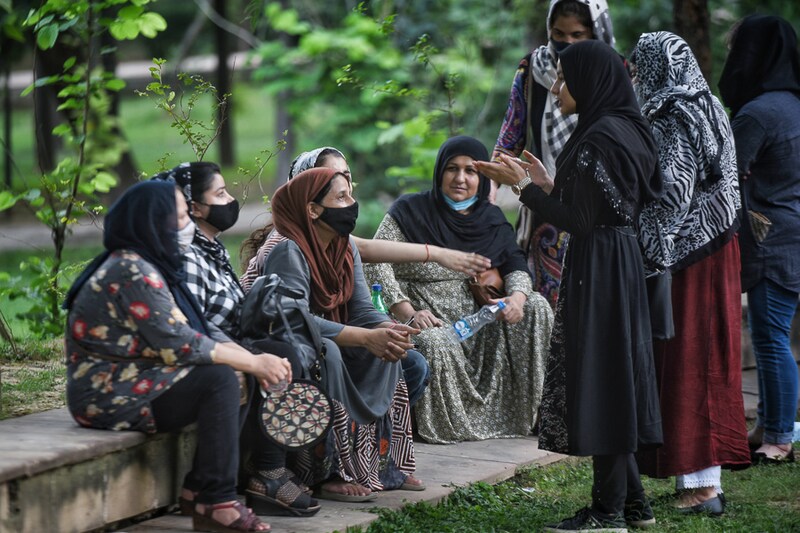 Afghan women gather to protest against the occupation of Afghanistan by Taliban fighters, at Jangpura on August 18, 2021 in New Delhi, India. Jangpura and Lajpat Nagar areas are home to a large number of Afghan refugees who thrive running small businesses.