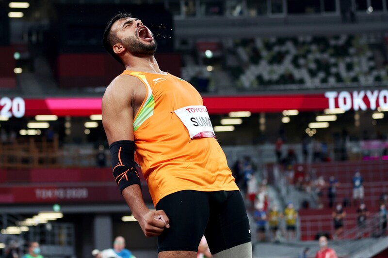 Sumit Antil of India exults after winning gold and setting a new world record of 68.55m in Men"s Javelin - F64 category Final at Tokyo 2020 Paralympic Games, Japan, August 30, 2021. A competitive wrestler before he lost his left leg in a bike accident in 2015, Sumit started yesterday with a world record throw before bettering it twice in the next four throws.