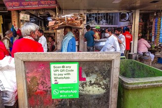 A WhatsApp pay payment sticker seen outside a food shop in Kolkata, 30 November 2021 . WhatsApp India plans to make significant investments in its payments platform across India in a bid to accelerate its growth in a market where digital payments have seen a significant rise in recent times.