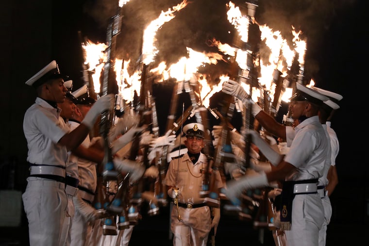 Indian Navy soldiers demonstrate their skills as they hold their rifles during a rehearsal ahead of Navy Day celebrations in Mumbai, India, December 2, 2021. The Indian Navy has been keeping a close watch on China"s activities in Indian Ocean lately, maintaining combat and mission readiness.