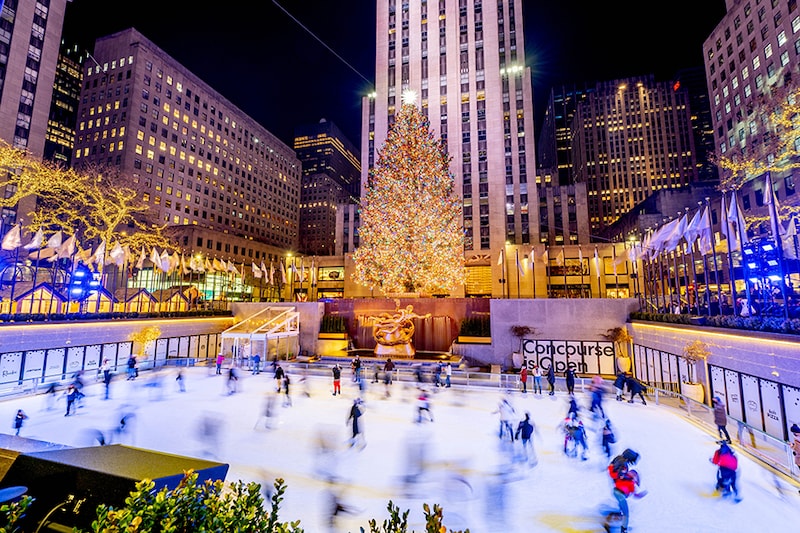 NEW YORK - DECEMBER 22: A view of the Rockefeller Plaza ice skating rink with the annual Christmas tree on December 22, 2021 in New York City.