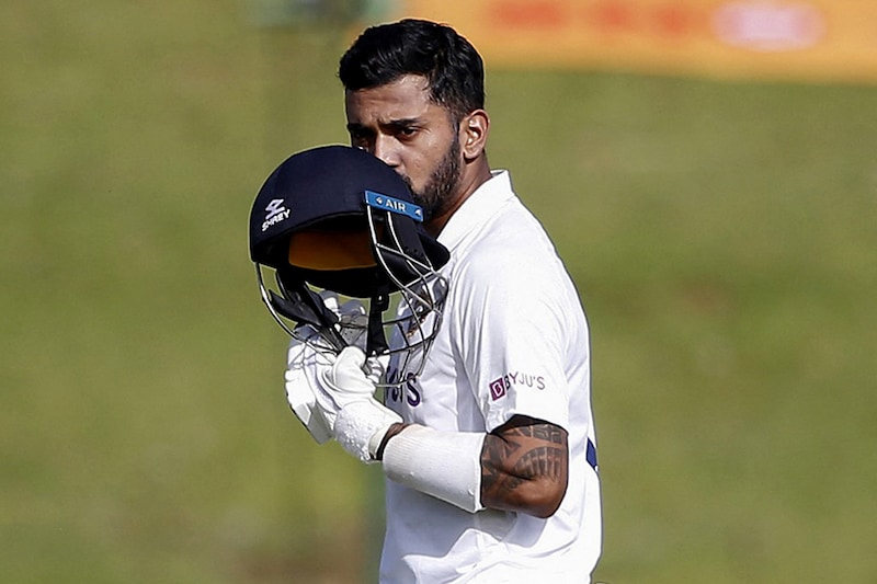 India"s KL Rahul kisses his helmet as he celebrates after scoring a century (100 runs) during the first day of the first Test cricket match between South Africa and India at SuperSport Park in Centurion on December 26, 2021.