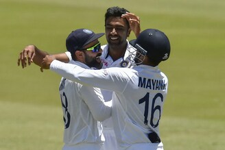 Captain Virat Kohli (L) celebrates with R Ashwin and Mayank Agarwal (R) after India won the first Test cricket match between South Africa and India at SuperSport Park in Centurion on December 30, 2021. India won the match by 113 runs.