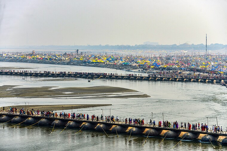 Hindu Devotees arrive at the Sangam area—the confluence of the Ganges, Yamuna and mythical Saraswati rivers—on the eve of auspicious bathing day of "Mauni Amavasya" during the annual Magh Mela festival in Allahabad on February 10, 2021.