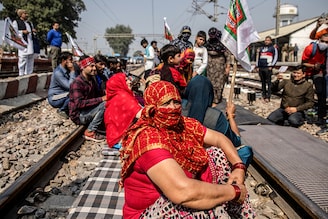 Farmers block railway tracks as part of protests against farm laws, in Sonipat, northern state of Haryana, India, February 18, 2021.