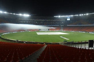 This photograph taken on February 23, 2021 shows fogging underway as a precautionary measure at the Sardar Patel Stadium, the world"s biggest cricket stadium, on the eve of the third Test match between India and England, in Motera, on the outskirts of Ahmedabad.