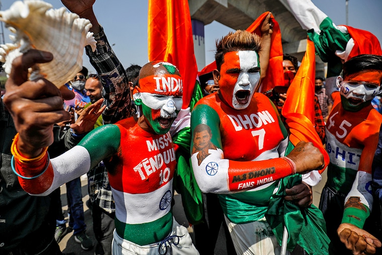 Fans react as they wait to enter the newly named Narendra Modi Stadium, previously known as Motera stadium, before the start of the third test match between India and England, amidst the spread of the coronavirus disease (COVID-19), in Ahmedabad, India, February 24, 2021.