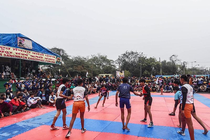 A kabbadi match underway on a rainy day at Singhu border during protests against new farm laws, on January 3, 2020 in New Delhi, India. Protests against the three agricultural laws reached day 37 on Friday, the first day of a new decade. Sixth round of talks took place between the government and the farmers" unions on Wednesday, with the two sides arriving at a consensus on two of the four issues raised by the farmers.