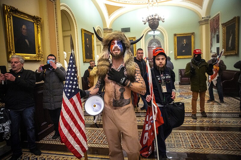 A pro-Trump mob confronts U.S. Capitol police outside the Senate chamber of the U.S. Capitol Building on January 06, 2021 in Washington, DC. Congress held a joint session today to ratify President-elect Joe Biden"s 306-232 Electoral College win over President Donald Trump. A group of Republican senators said they would reject the Electoral College votes of several states unless Congress appointed a commission to audit the election results.
