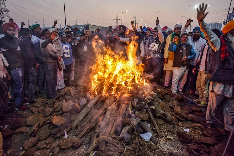 Farmers celebrate Lohri festival amid the ongoing protest against the new farm laws, at Ghazipur (Delhi-UP border) on January 13, 2021 in New Delhi, India.