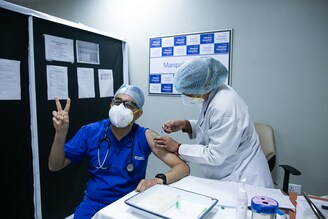 Dr. Sushant Chhabra, head of emergency medicine at Manipal Hospital Delhi takes the first jab of covishield vaccine on the opening day of the nationwide programme. "It"s been an epic journey through the pandemic for me", says Chhabra, "so taking this vaccine, it"s indescribable, this feeling ..."