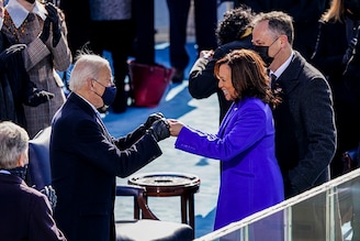 U.S. President Joe Biden, left, fist bumps Vice President Kamala Harris during the inauguration ceremony on the West Front of the U.S. Capitol on January 20, 2021 in Washington, DC. During yesterday"s inauguration ceremony Joe Biden becomes the 46th President of the United States and Kamala Harris created history becoming the first ever female Vice President of the United States.
