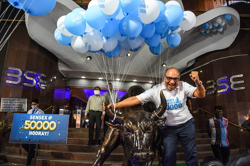 An employee of the Bombay Stock Exchange (BSE) poses for a picture inside the office premises, after Sensex surpassed the 50,000 level for the first time, in Mumbai, India, January 21, 2021.