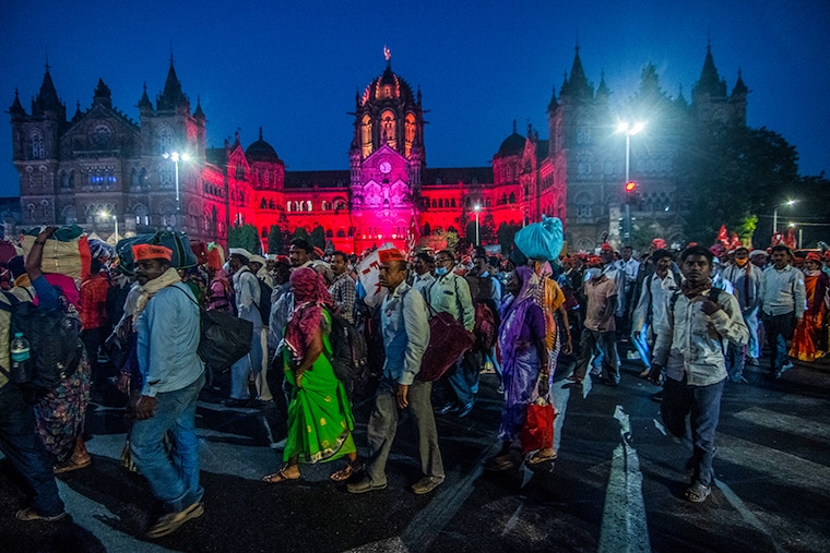 Farmers who have been walking from Nashik, to participate in a rally organized by Akhil Bharatiya Kisan Sabha on January 26, reached CSMT station, on January 24, 2021 In Mumbai, India. The farmers owe allegiance to over a 100 organisations under the umbrella of Samyukta Kisan Morcha (SKM), which has given a nationwide call for similar agitations between January 23-26, including taking out rallies to Raj Bhavans in all states.