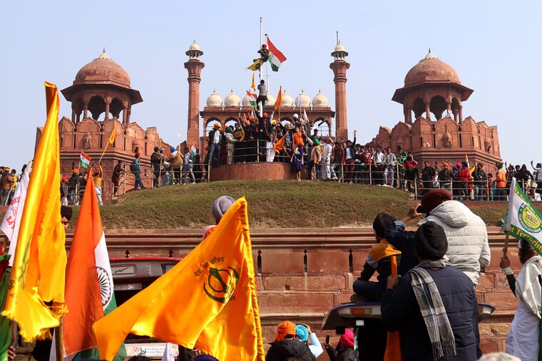 Thousands of protesting farmers broke past the designated routes of their tractor rally, stormed the Red Fort in India"s Capital and hoisted flags on India"s Republic Day. January 26, 2021.