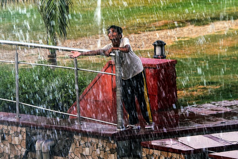 A boy near a water fountain at Central Park, on July 1, 2021 in New Delhi, India. A day after the "severe heat wave" gripped the city with mercury rising to 43.5 degrees Celsius, seven notches above the normal and the highest this year, the IMD said the minimum temperature registered on Thursday morning at 31.7 degrees was also four notches above normal.