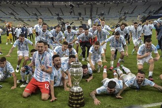 Players of Argentina celebrate with the trophy after winning the Conmebol 2021 Copa America football tournament final match against Brazil at Maracana Stadium in Rio de Janeiro, Brazil, on July 10, 2021. Argentina beat Brazil 1-0 to win record-equalling 15th Copa America title.