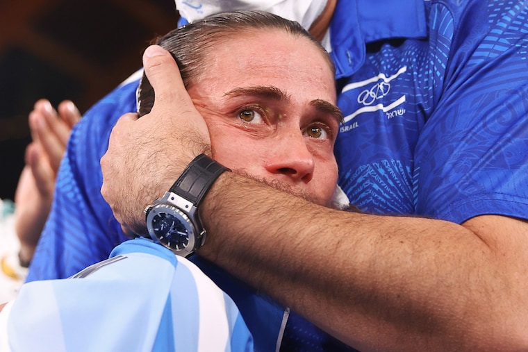 Uzbek gymnast Oksana Chusovitina is embraced by physiotherapist Orabi Bader after her performance on the vault at Ariake Gymnastics Centre, Tokyo"‹. At 46, Chusovitina has defied all odds to compete at her eighth Olympic Games in Tokyo and has participated in every Olympics since 1992 representing the Soviet Union, Germany, and Uzbekistan. She bid a tearful farewell after failing to make the cut for the vault final.