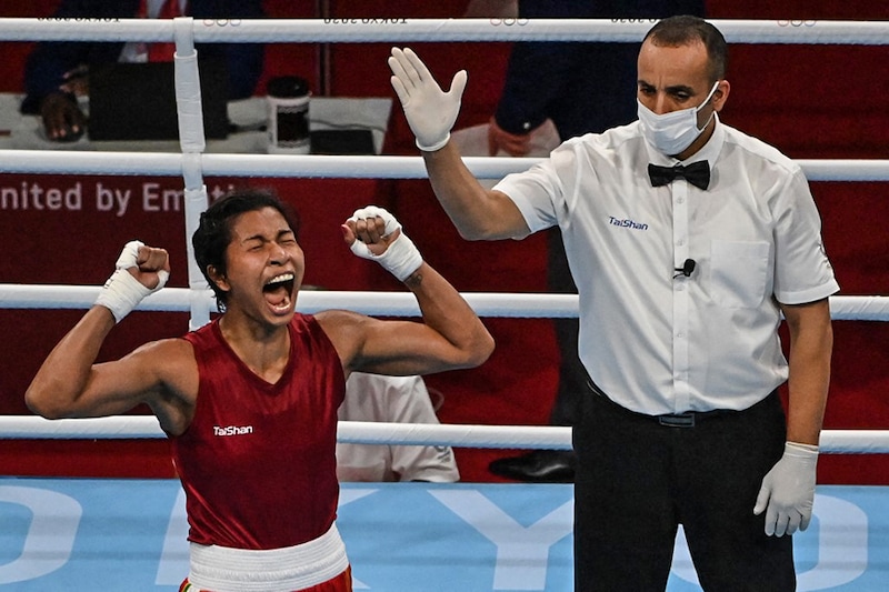 India"s Lovlina Borgohain celebrates her win against Chinese Taipei"s Nien-Chin Chen after their women"s welter (64-69kg) quarter-final boxing match during the Tokyo 2020 Olympic Games at the Kokugikan Arena in Tokyo on July 30, 2021.