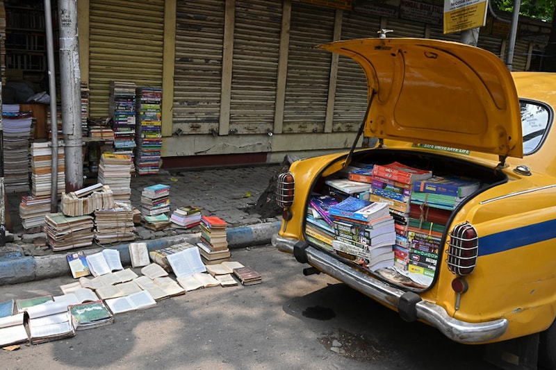 Books lay near roadside bookshops as shopkeepers prepare to reopen today following an exception for small retail shops during a lockdown imposed by West Bengal state to curb the spread of Covid-19 coronavirus, in Kolkata on June 1, 2021.