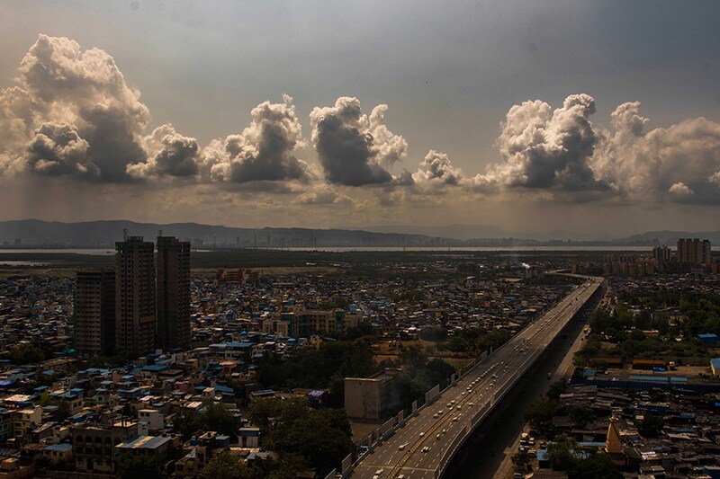 An aerial view of the Ghatkopar-Mankhurd Link Road flyover with the sky above overcast with thick clouds on June 4, 2021, in Mumbai, India. The India Meteorological Department (IMD) says the southwest monsoon winds have hit the coast of Kerala, two days behind schedule. According to the IMD, the monsoon will set over Mumbai and adjoining areas between June 10 and June 11.
