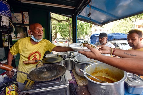 Kanta Prasad, 80, opens for business and is seen at his food stall Baba Ka Dhaba, in Malviya Nagar, on June 5, 2021 in New Delhi, India. Delhi chief minister Arvind Kejriwal said on Saturday that the lockdown, imposed since April 19 to curb the spread of Covid-19, will continue in the national capital but with some relaxations. Kejriwal said local markets can open on an odd and even basis from 10am to 8pm. Malls can also resume their business but will be required to follow the same guidelines. Standalone shops can be open on all days.