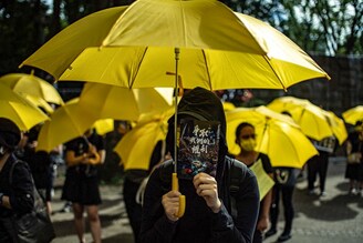 Pro-democracy activists take part in a rally in Tokyo"s Shinjuku district on June 12, 2021, to mark the second anniversary of the start of massive pro-democracy protests which roiled Hong Kong in 2019. The fear of facial recognition software used by the authorities to crack down on protestors was writ large among those gathered.