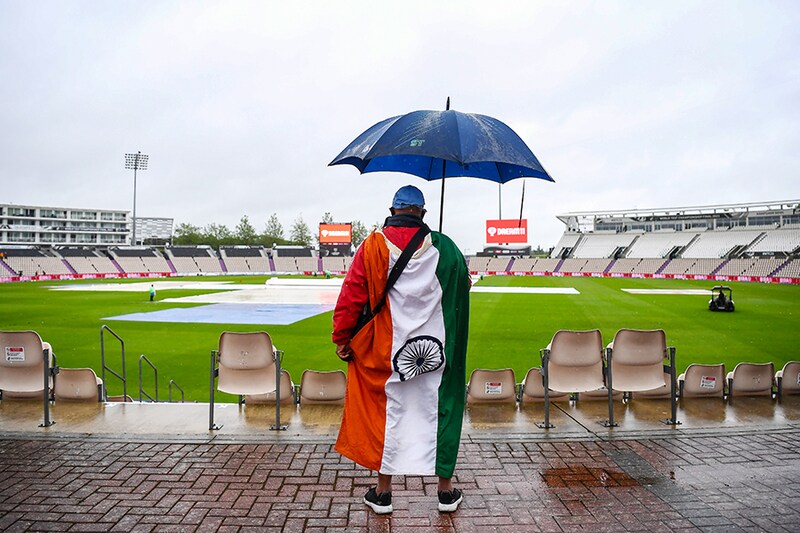 An Indian fan looks on as play is delayed on Day 1 of the ICC World Test Championship Final between India and New Zealand at The Hampshire Bowl on June 18, 2021, in Southampton, England.