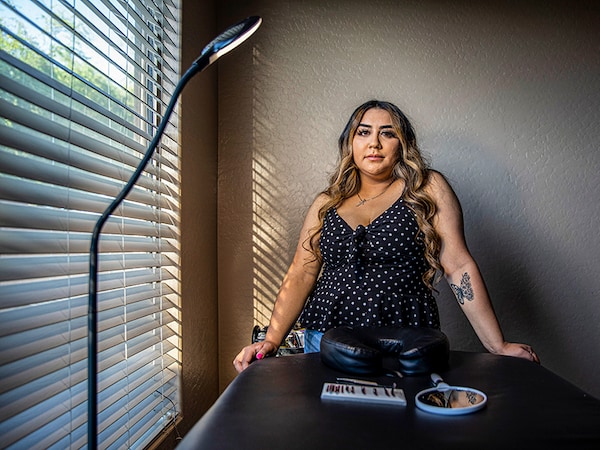 Luz Portillo at home in Avondale, Ariz., where she receives clients for her eyelash extension business, on May 30, 2021. Portillo plans to delay pregnancy until she establishes her career. Image: Adriana Zehbrauskas/The New York Times