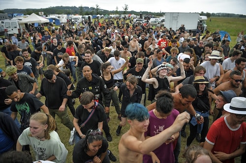 Defying an 11 pm coronavirus curfew, participants take part in an illegal rave party in a field in Redon, north-western France, on June 19, 2021. Five police officers were injured overnight in western France as they broke up a 1,500-strong illegal rave. France"s curfew, among the strictest and longest in Europe, has prompted growing frustrations among young people