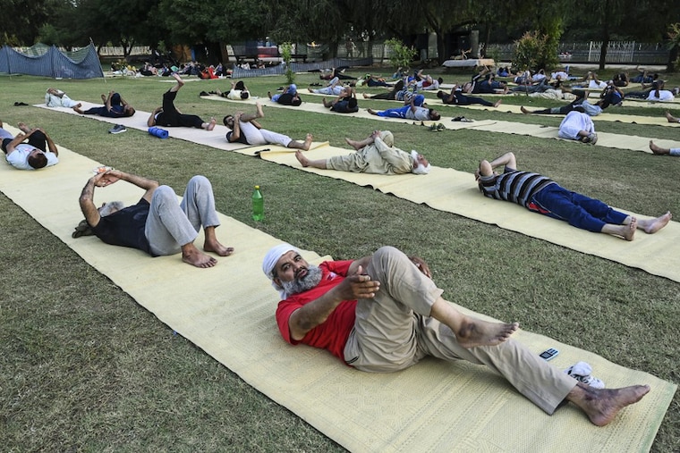 People practice Yoga ahead of the International Yoga day in Lahore, Pakistan on June 20, 2021. Yoga has a large following in the most of the major towns and cities.
