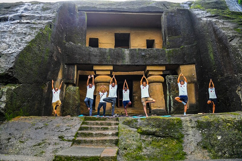 People take part in a yoga session at the Kanheri Caves on the outskirts of Mumbai on June 21, 2021, to mark International Yoga Day.