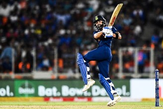 India"s captain Virat Kohli hits a boundary to win the second Twenty20 international cricket match against England at the Narendra Modi Stadium in Motera on March 14, 2021.