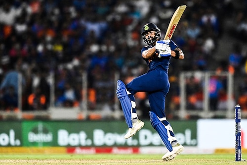 India"s captain Virat Kohli hits a boundary to win the second Twenty20 international cricket match against England at the Narendra Modi Stadium in Motera on March 14, 2021.