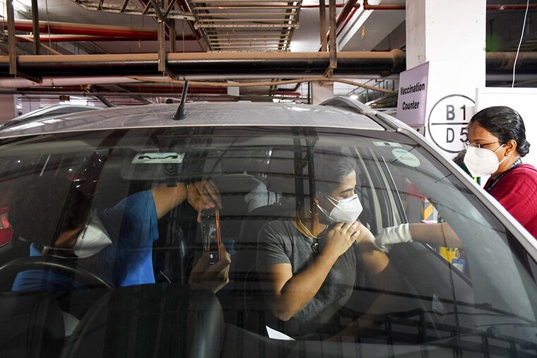 Drive-in-car vaccination center facility at BMC parking lot in Dadar, Mumbai.