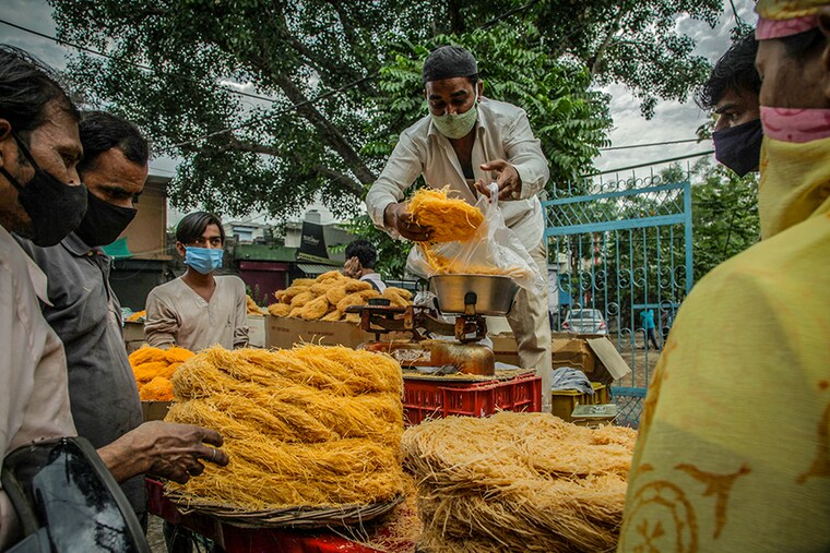 Muslim devotees buy vermicelli on the eve of Eid-ul-Fitr in Gurgaon, India, on 13th May, 2021.