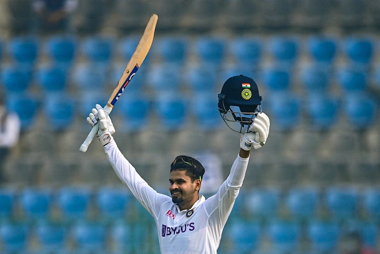 India"s Shreyas Iyer celebrates after scoring a century (100 runs) during the second day of the first Test cricket match between India and New Zealand at the Green Park Stadium in Kanpur on November 26, 2021.
