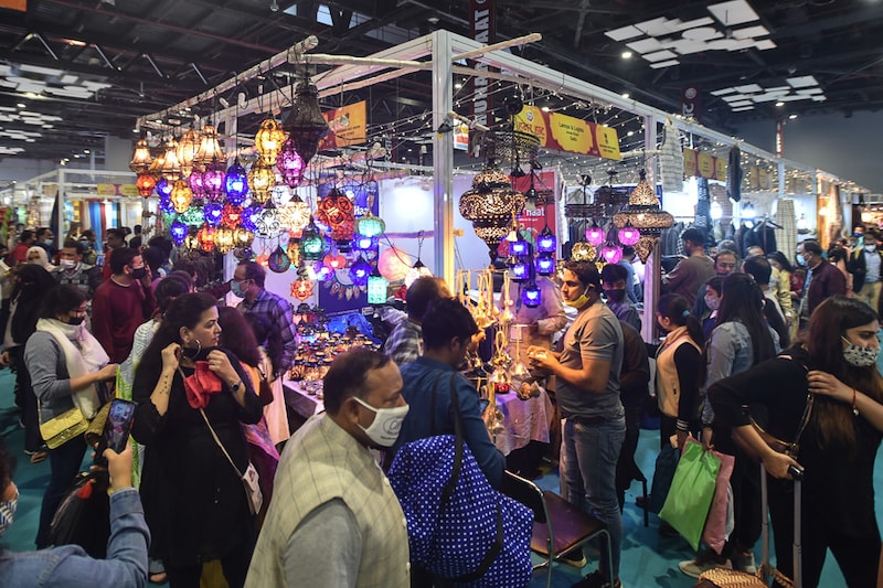 Visitors throng the Hunar Haat stalls on the closing day of the 40th India International Trade Fair 2021, at Pragati Maidan, New Delhi on November 27, 2021. One of the country"s largest commercial and trade events, nearly 3,000 exhibitors from 20 states, three union territories and nine countries participated in this year’s fair, themed Aatmanirbhar Bharat. Over 550 artisans from states across India participated in the 33rd Hunar Haat, selling indigenous handicrafts like hand-embroidered Pashmina shawls, handmade bamboo bags, hand-carved wooden vases and more.