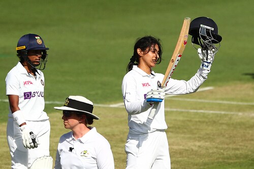 Smriti Mandhana celebrates her century during Day 2 of the Women"s International Pink-Ball Test match between Australia and India at Metricon Stadium on October 01, 2021 in Gold Coast, Australia. Smriti Mandhana’s 100 is the first for an Indian women cricketer on Australian soil, and she is the only non-England woman cricketer to score a century against Australia in Australia.