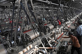 Labourers work at a private jute mill in Jagatdal, West Bengal on October 05, 2021. Nearly all of the world"s jute is grown in India and Bangladesh. From the boutiques of Christian Dior to royal wedding favours, jute is growing in popularity worldwide as the demand for alternatives to plastic soars. Experts predict that the bag industry alone will be worth more than $3 billion by 2024.