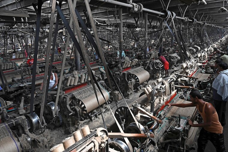 Labourers work at a private jute mill in Jagatdal, West Bengal on October 05, 2021. Nearly all of the world"s jute is grown in India and Bangladesh. From the boutiques of Christian Dior to royal wedding favours, jute is growing in popularity worldwide as the demand for alternatives to plastic soars. Experts predict that the bag industry alone will be worth more than $3 billion by 2024.