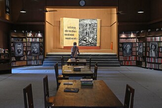 An unusual Durga Puja pandal espousing the theme of a community library greets a visitor in Kolkata on October 8, 2021. The pandals are a canvas for artists and artisans to unleash their creative talent on themes that"s making news around the country and the world.