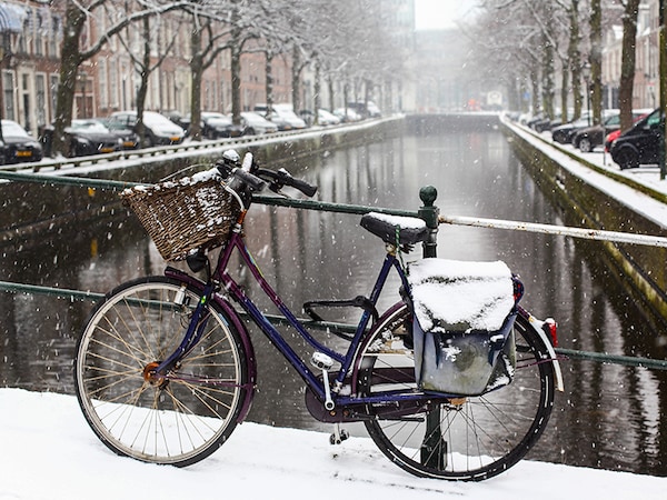 City cyclists may be put off by snow and rain but not necessarily everywhere. Image: Patrick Messier / Shutterstock